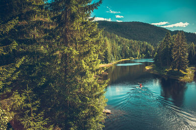 Man kayaking in lake