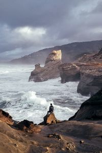 Scenic view of sea against cloudy sky