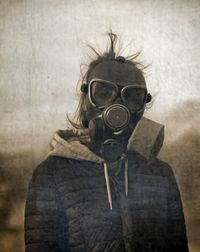 Portrait of woman wearing gas mask