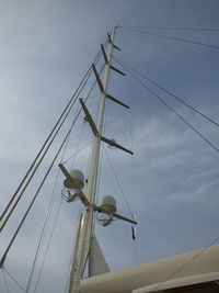Low angle view of electricity pylon against sky
