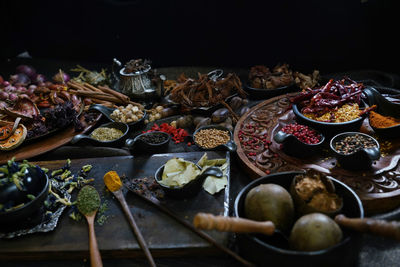 A variety spices and herbs in wooden bowls, of asians for cooking thai seasonings and herbs