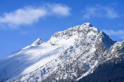 Low angle view of snow mountain against sky