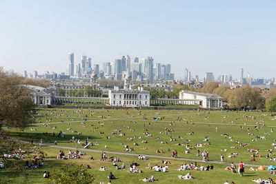 Group of people in front of modern buildings
