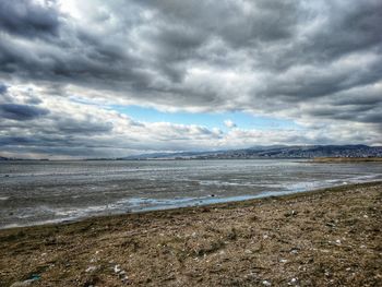 Scenic view of beach against sky