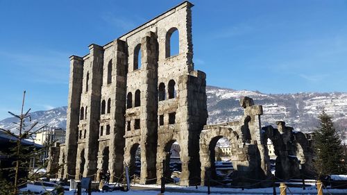 Low angle view of old building in winter