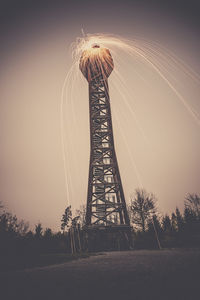 Low angle view of ferris wheel against sky