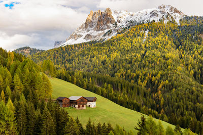 View of agricultural landscape against cloudy sky