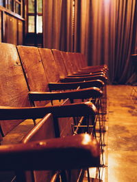 Close-up of empty chairs on table