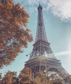 Low angle view of tower against cloudy sky