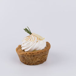 Close-up of cake against white background