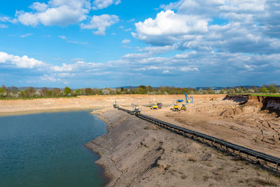 A string of transport belting in a gravel pit for transporting gravel and sand over long distances