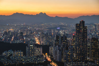 Cityscape against sky during sunset