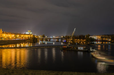 Illuminated city at waterfront