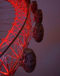 Low angle view of ferris wheel against sky