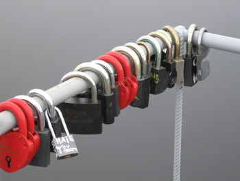 Close-up of padlocks hanging on metal