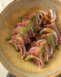 High angle view of food on a table. carpaccio made with bonito fish.