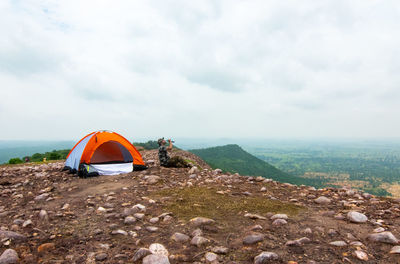 Tent on land against sky