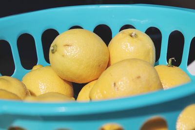 Close-up of lemons in basket