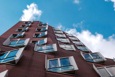 Low angle view of modern building against sky