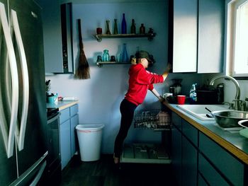 Full length of woman standing at home