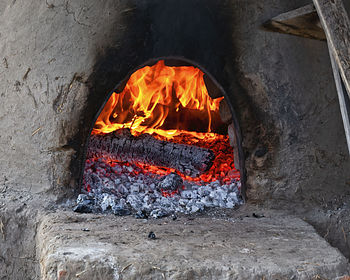 High angle view of fire on wood