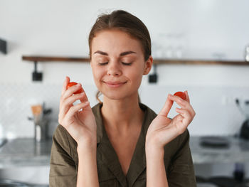 Portrait of young woman using mobile phone