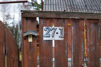 Close-up of birdhouse on wooden door