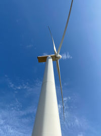 Low angle view of wind turbine against sky