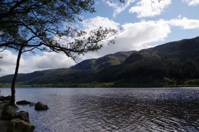 Scenic view of lake against cloudy sky