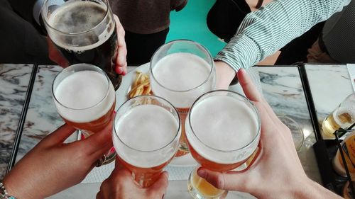 High angle view of people having drinks at table