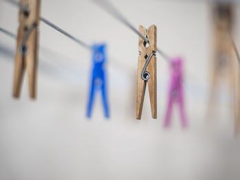 Close-up of clothespins on clothesline