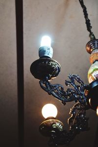 Low angle view of illuminated light bulb