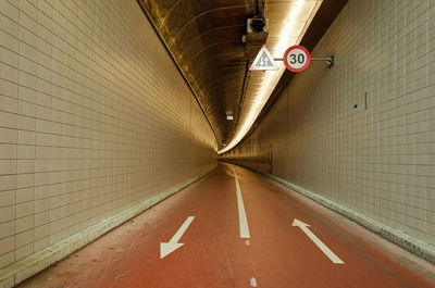 The gently curving beneluxtunnel for pedestrians and cyclists under the river nieuwe maas