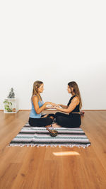 Two women doing reiki each other