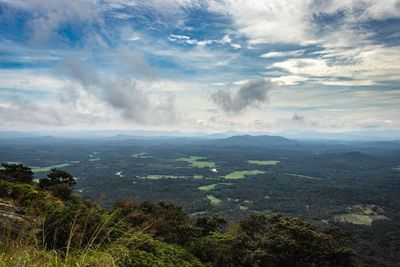 Mountain horizon coverd with cloud layers and forests