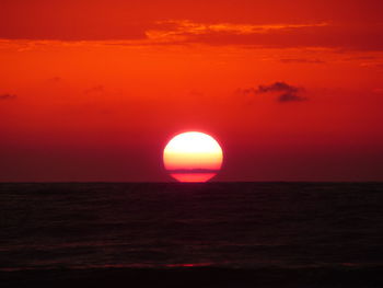 Scenic view of sea against romantic sky at sunset