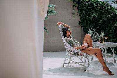 Young woman sitting on chair