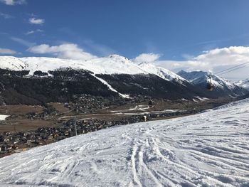 Snowcapped mountains against sky