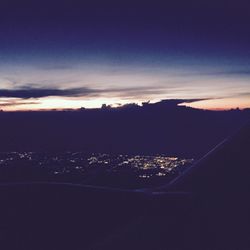 Scenic view of mountains against sky at sunset