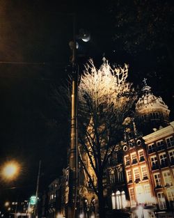 Low angle view of illuminated building at night
