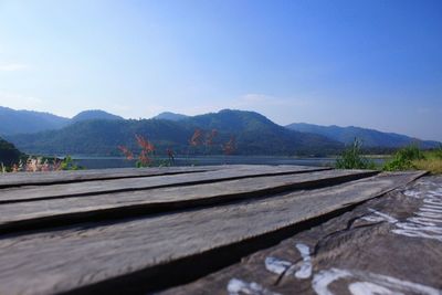 Scenic view of mountains against clear blue sky