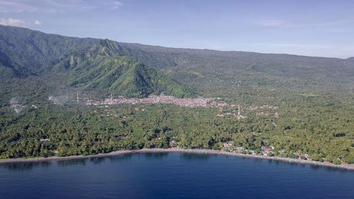 Scenic view of lake and mountains against sky