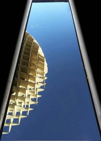 Low angle view of built structure against blue sky