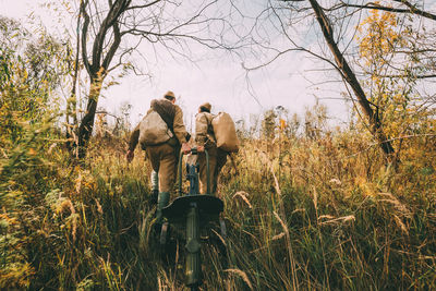 Rear view of man standing on field