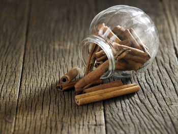 Close-up of cinnamon in jar on table