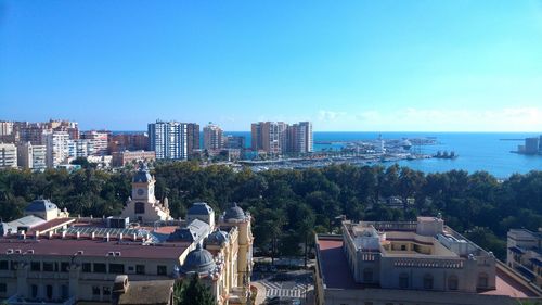 View of cityscape against blue sky
