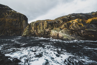 Scenic view of mountains and sea against sky