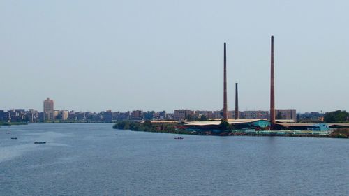 View of buildings in city against clear sky
