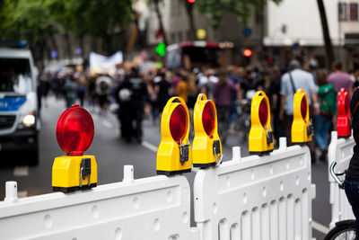 Close-up of road reflectors on street in city