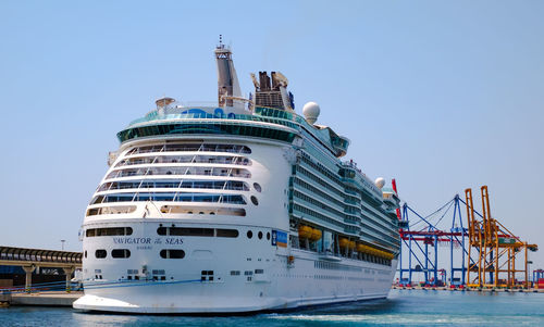 Ship moored in water against clear sky